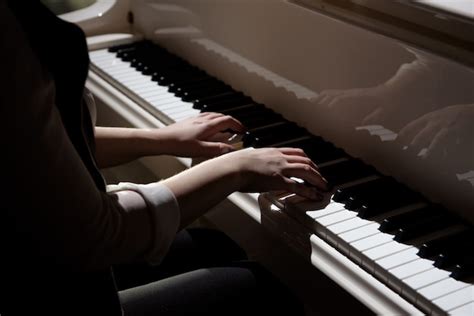 Premium Photo Woman Hands Playing A Piano Musical Instrument
