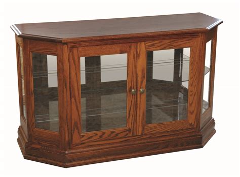Curio cabinets and displays can help keep your favorite keepsakes securely locked away behind glass doors that will still let them shine as decorative accents to any room. Angled Curio Console | Hardwood Creations