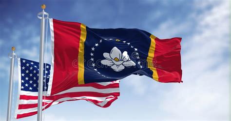 The Mississippi State Flag Waving Along With The National Flag Of The