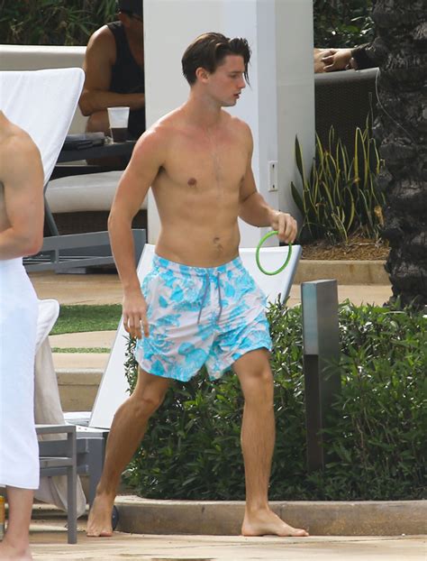 Patrick Schwarzenegger Enjoys The Pool WIth Friends In Miami Fringues