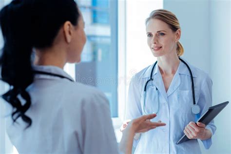 Delighted Medical Worker Listening Her Assistant Stock Photo Image Of