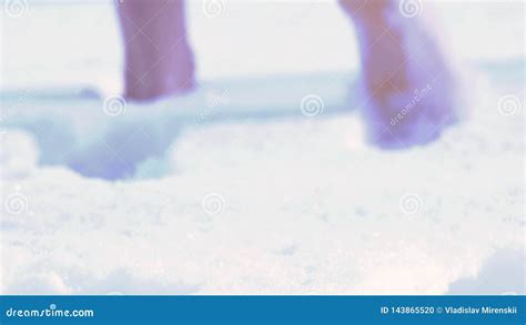 A Man With Bare Feet Goes Through The Loose Snow Stock Footage Video