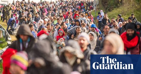 Police Escort Refugees Through Slovenia In Pictures World News The Guardian