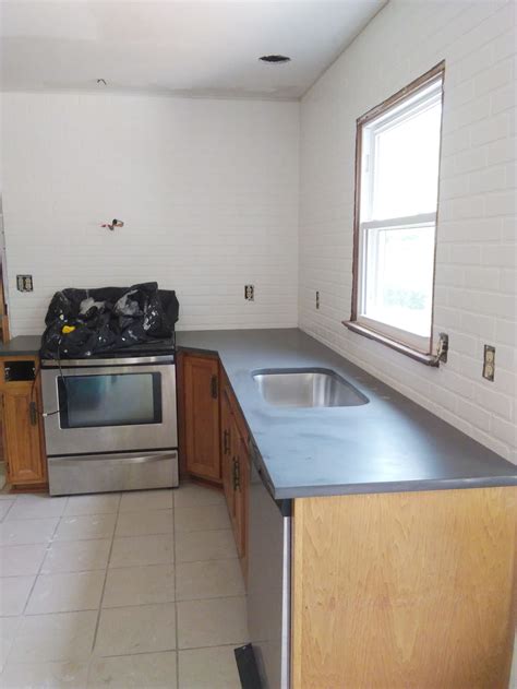 This kitchen is such a wonderful mix of soft and rough textures, and also of modern and traditional materials. How to Install a Faux Brick Backsplash - Craftivity Designs