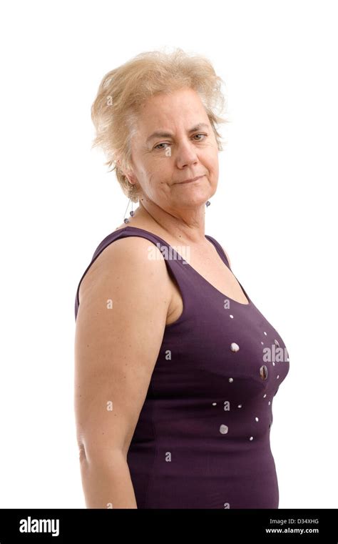 Confident Mature Woman Wearing A Purple Sleeveless Shirt And Looking