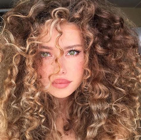 image may contain 1 person closeup blonde curly hair short curly hair natural hair styles