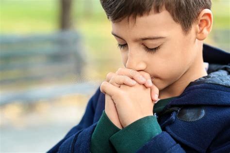 Little Boy Praying Outdoors Stock Photo Image Of Childhood Church