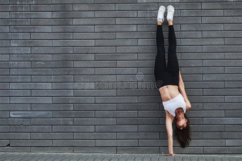 Doing Handstand Side View Of Girl In Sportswear Doing Stretch