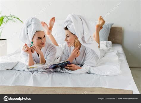Stylish Barefoot Women Bathrobes Earrings Towels Heads Reading Magazine