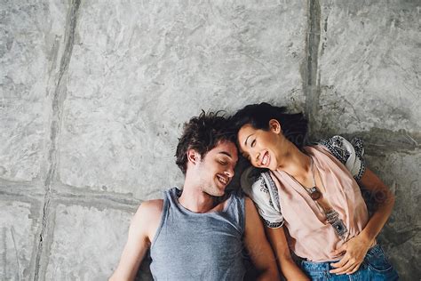 Happy Couple Lying On The Floor Del Colaborador De Stocksy Lumina