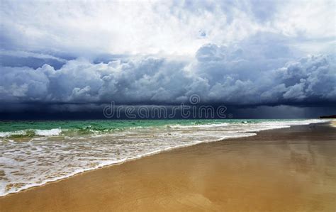 Dramatic Dark Storm Clouds Coming Over Sea Stock Photo