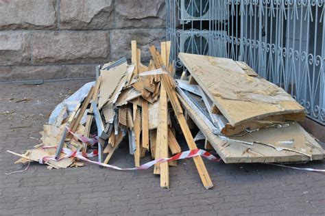 Construction Debris Wooden Boards And Cardboard On The Street After