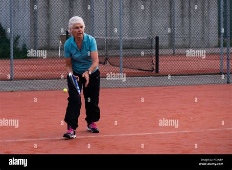 Mature Woman Playing Tennis High Resolution Stock Photography And