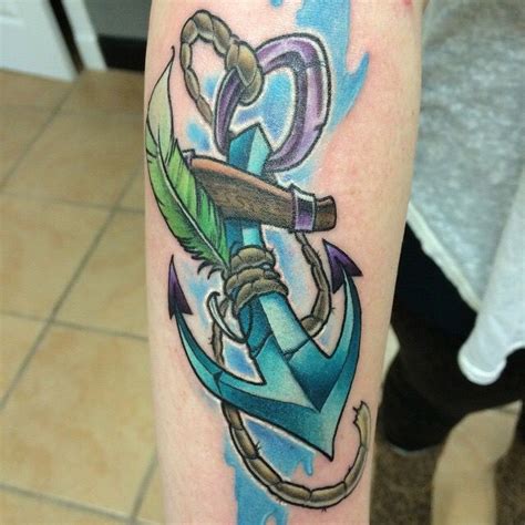 An Anchor Tattoo On The Arm With Watercolor Paint