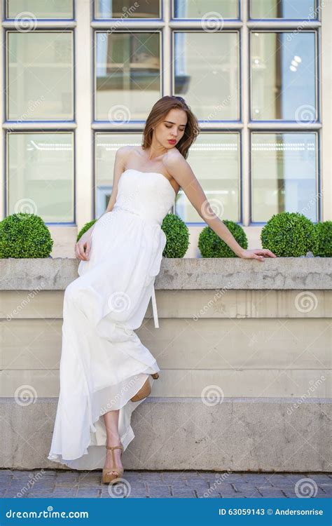 Full Length Portrait Of Beautiful Model Woman With Long Legs Wearing