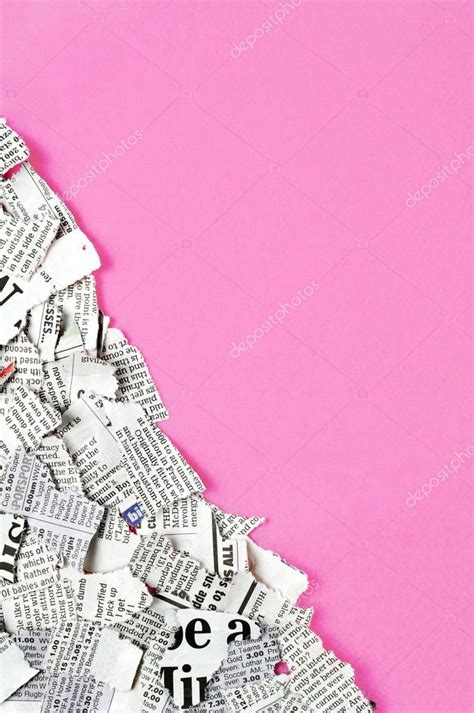 Shredded Newspaper Pieces In Bottom Left Corner On A Dark Pink Surface