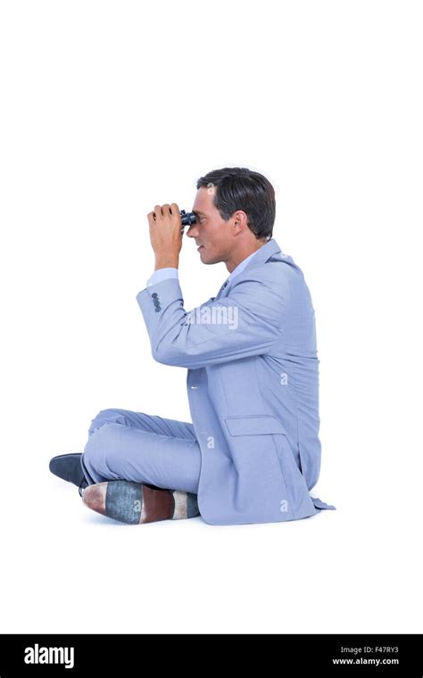 Businessman Looking Through Binoculars Stock Photo Alamy