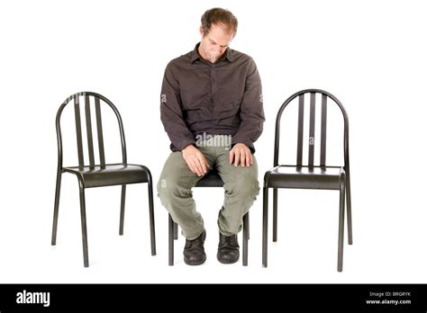 Very Sad Man Seated On Chair Alone Stock Photo Alamy