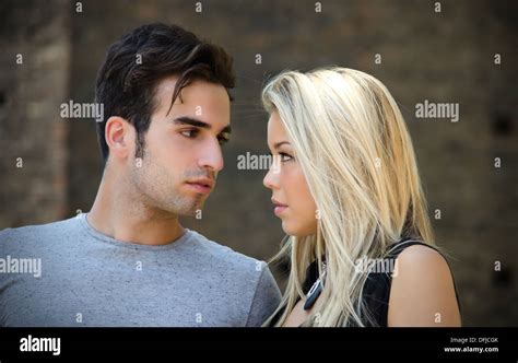 Attractive Couple In Love Looking Into Each Other S Eyes Blonde Girl Brown Haired Guy