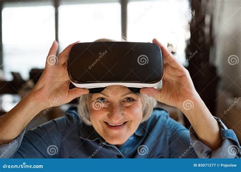 Senior Woman Wearing Virtual Reality Goggles At Home Stock Image Image Of Display Game 85071277