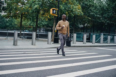 Black Man Walking On Crosswalk · Free Stock Photo