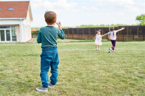 Group Of Children Playing In Front Yard Stock Image Image Of Joyful