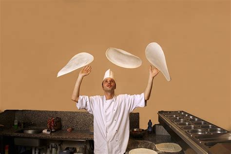 Italian Pizza Baker Throwing Dough Into License Images 369372