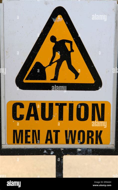 Warning Sign Caution Men At Work Stock Photo Alamy