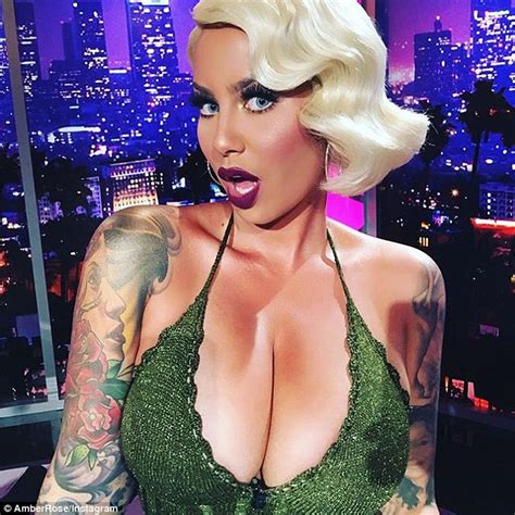 Amber Rose Flaunts Her Cleavage In Cut Out Black Top In Instagram