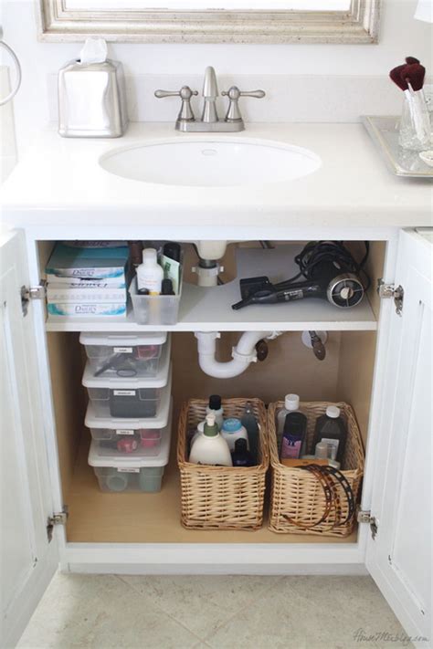 Use a shower caddie with several compartments to organize your feminine hygiene products. Creative Under Sink Storage Ideas - Hative