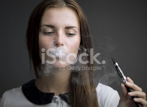 Elegant Woman Smoking E Cigarette With Smoke Stock Photo Royalty Free