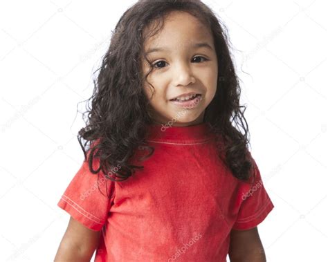 Smiling Mixed Race Little Girl With Long Hair And A Bright Red Shirt