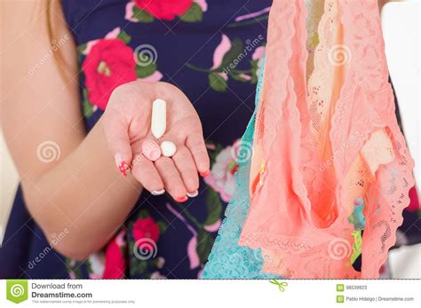 Close Up Of A Woman Hands Holding An Assorted Colorful Underwears And
