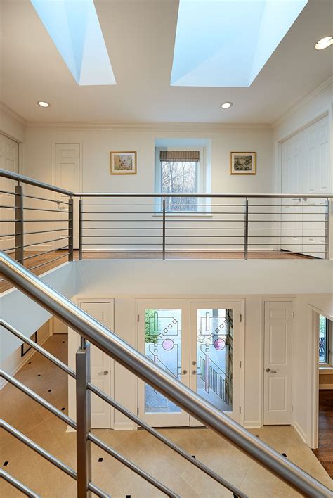 Stunning Contemporary Wrap Staircase Showcases Modern Artwork And