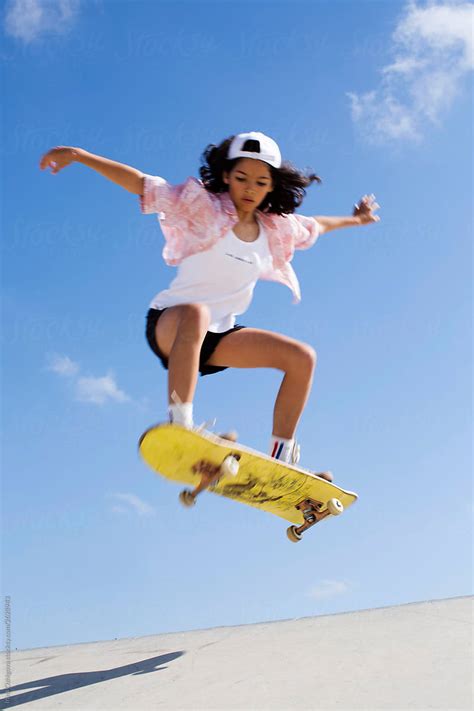 Teen Girl Make An Ollie On A Skateboard By Stocksy Contributor Irina