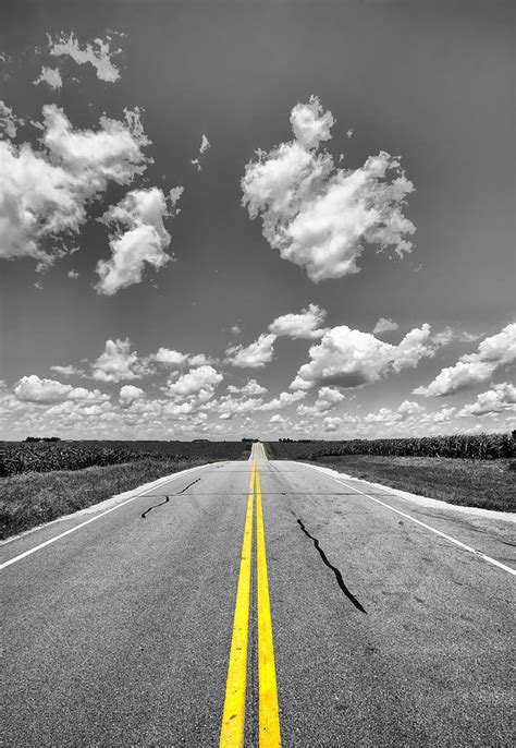 Down A Black And White Road Photograph By Bill Tiepelman