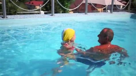 Grandpa Teaches Granddaughter To Swim ⬇ Video By © Pahal Stock Footage