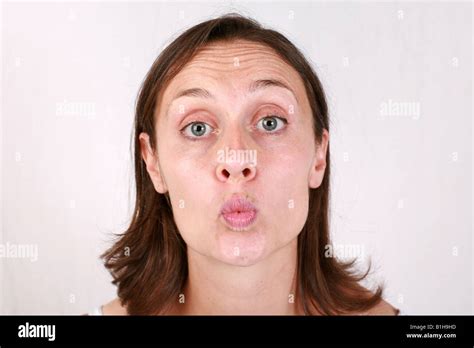 Young Brunette Woman Purses Lips Blows Kiss Closeup Head Shoulders Head Shot Fully Released