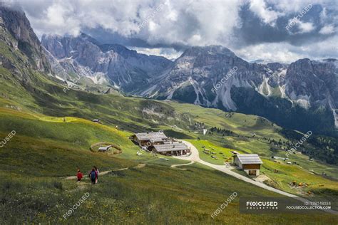 Italy Dolomites Odle Mountain Range Hikers Heading To A Chalet
