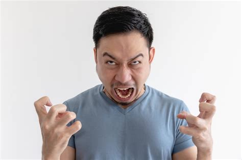 Premium Photo Angry And Mad Face Of Man In Blue T Shirt On Isolated Wall