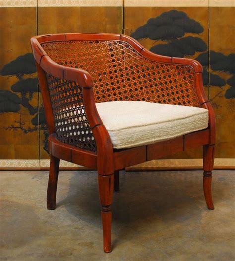 Pair french walnut tub chairs with double bergère cane backs and overstuffed seats and a pair of inlaid side chairs with bergère cane seats and ba. Midcentury Bamboo Cane Barrel Chair For Sale at 1stdibs