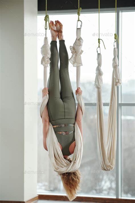 Back View Of Active Babe Woman Hanging Upside Down And Holding By White Hammock Stock Photo By