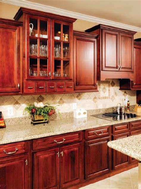 Solid wood cabinets made from cherry can transform any kitchen into a warm, inviting space at a cost lower than you might expect. The RANDOLPH is a brightly stained Walnut #Kitchen # ...