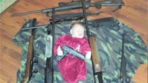 Shooting Range Posts Controversial Photo Of Baby Surrounded By Rifles