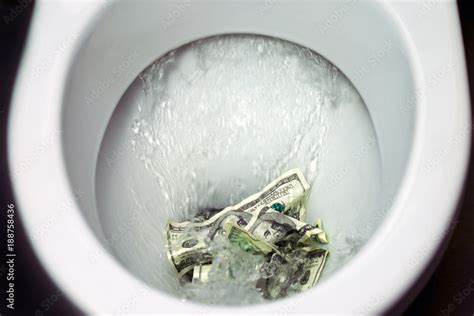 Flush Money Down The Toilet Throws Dollar Bills In The Toilet Loss Concept Close Up