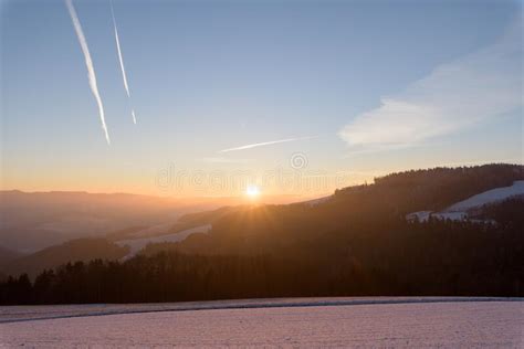 Sunny Clear Winter Sunrise Landscape Over A Snow Field Valley And