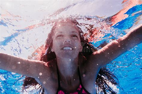 Happy Caucasian Woman Diving In Swimming Pool Underwater View Stock