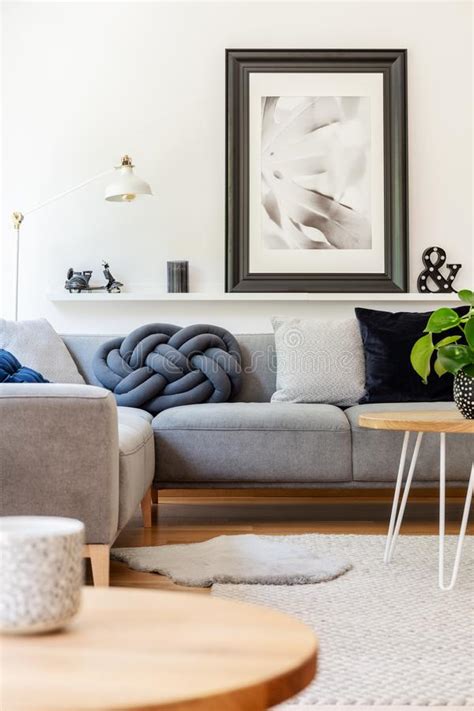 Grey Corner Couch With Cushions In Real Photo Of White Living Room