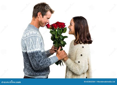 Romantic Couple Holding Red Roses Stock Photo Image Of Cheerful