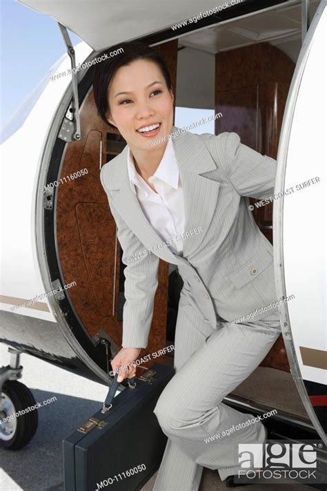 Asian Businesswoman Getting Off Private Airplane Stock Photo Picture